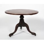 A Georgian mahogany low tripod table, late 18th century, later adapted as a sofa table,