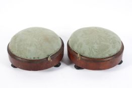 Two Victorian mahogany footstools, of circular form, each upholstered in duck egg damask,