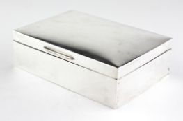 A George V silver cigarette box of plain, rectangular form, hallmarked Birmingham 1931,