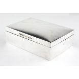 A George V silver cigarette box of plain, rectangular form, hallmarked Birmingham 1931,