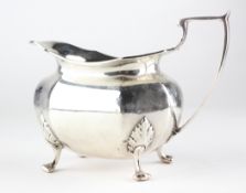 A George V silver milk jug, hallmarked Sheffield 1919, makers mark rubbed, 198g,