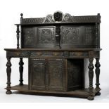 A 19th century oak buffet, the scrolling gallery above a single shelf and four carved panels,
