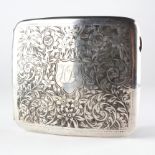 A George V silver cigarette case adorned with highly detailed floral engraved sprays,