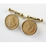 A yellow metal pair of cufflinks with Tbar and chain attachment,