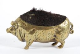 A Victorian brass pig-shaped pen wipe, late 19th century,