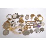 A large collection of jewellery to include brooches, necklaces, pendants with chains, two watches,