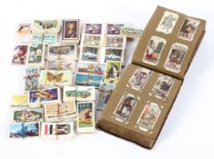 A collection of vintage Player's Cigarette cards, some mounted in an antique leather album,