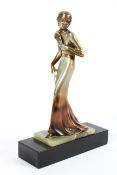 An Art Deco style sculpture of a lady, on green onyx and black slate base,