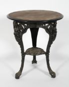 A Victorian style cast metal pub table, the wooden top the base with female caryatids, 71cm high,