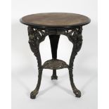 A Victorian style cast metal pub table, the wooden top the base with female caryatids, 71cm high,