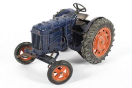 A Chad Valley 1/16 scale Fordson clockwork tractor, in blue and orange,