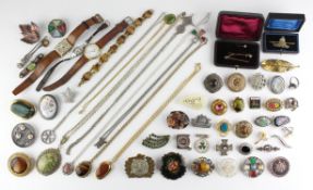A large collection of costume jewellery consisting of brooches, necklaces and two wristwatches.