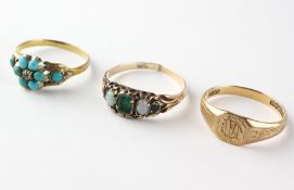 A collection of three rings to include a turquoise daisy cluster,