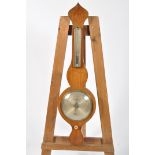 A 19th century wheel barometer, by Why & Creek, Sandy, with silvered thermometer and main dial,