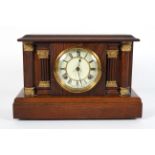 An oak striking mantel clock, early 20th century, of architectural form,