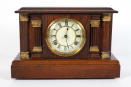 An oak striking mantel clock, early 20th century, of architectural form,