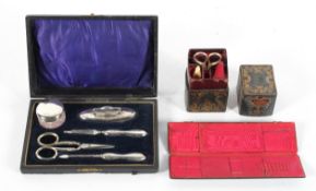 A Victorian silver-mounted ladies boxed manicure set and other similar items,