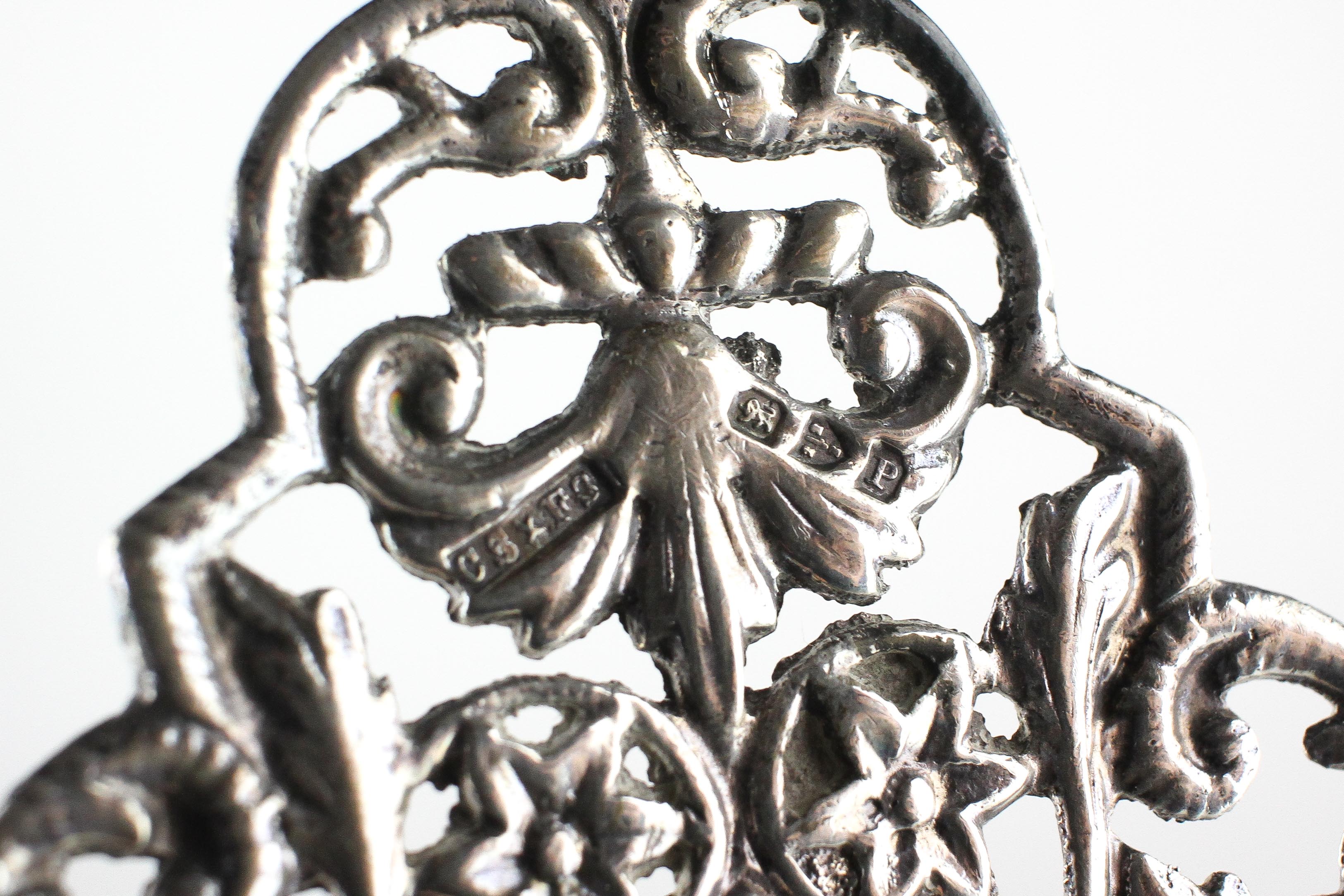 A large late Victorian silver buckle decorated with cast and pierced leaf and flower head design, - Image 2 of 2