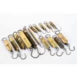 A collection of fifteen brass spring balances, by various markers,