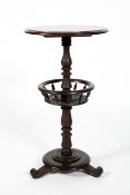 A Victorian mahogany two tier circular table, the lower shelf with bobbin turned spindles,