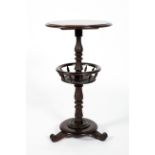 A Victorian mahogany two tier circular table, the lower shelf with bobbin turned spindles,