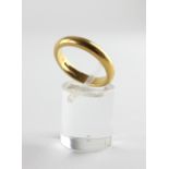 A yellow metal heavy court shape wedding ring, 3.8mm.