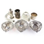A collection of various silver items, including three pierced dishes, a walking cane handle,