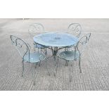A vintage French metal table and four chairs, in metallic pale blue,
