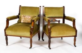 A pair of Edwardian mahogany and inlaid armchairs, with green velour upholstered back,