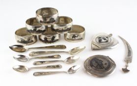 A collection of Indian white metal, inlaid with Niello decoration, to include napkin rings.