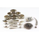 A collection of Indian white metal, inlaid with Niello decoration, to include napkin rings.