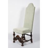 A Victorian oak-framed high-back hall chair in the 17th century style, with arched back,