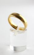 A yellow metal heavy court shape wedding ring, 5mm. Hallmarked 22ct gold, Birmingham, 1971 Size M