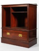 A Victorian mahogany campaign-style bookcase, late 19th century, flanked by reeded side panels,