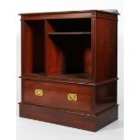 A Victorian mahogany campaign-style bookcase, late 19th century, flanked by reeded side panels,