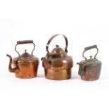 Three Victorian copper kettles, late 19th century, each with upright handle, two with domed covers,