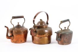 Three Victorian copper kettles, late 19th century, each with upright handle, two with domed covers,