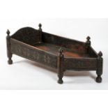 An Indian carved hardwood cot, 19th century, of canted rectangular form,