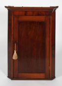 A Georgian mahogany corner cupboard, late 18th century,