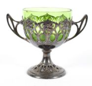 An EPNS mounted green glass Art nouveau goblet, pierced with stylised flowers,