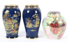 A pair of Crown Devon blue-ground baluster vases and a Maling ginger jar and cover, circa 1920,