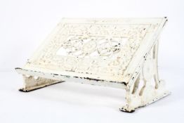 A late Victorian painted cast iron book stand by Osborne Garrett & Co, circa 1890,