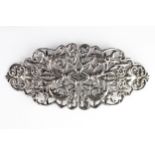 A large late Victorian silver buckle decorated with cast and pierced leaf and flower head design,
