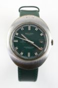 A stainless steel backed Sicura 25 jewel wristwatch with date feature and green leather strap. 70.