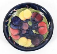 A Moorcroft Fruit and Berries dish, blue signature and impressed marks,