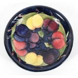 A Moorcroft Fruit and Berries dish, blue signature and impressed marks,