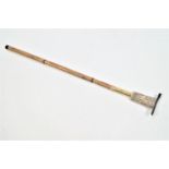 A malacca brass and carved bone mounted walking stick/cane,