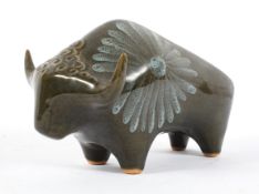 A Lotus factory pottery model of a stylised bull, 1960's,