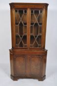 A Georgian style mahogany corner cabinet,