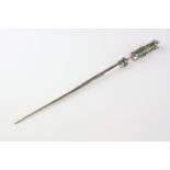 An Arts and Crafts white metal and fluorite pointer or hat pin, probably Austro-Hungarian,